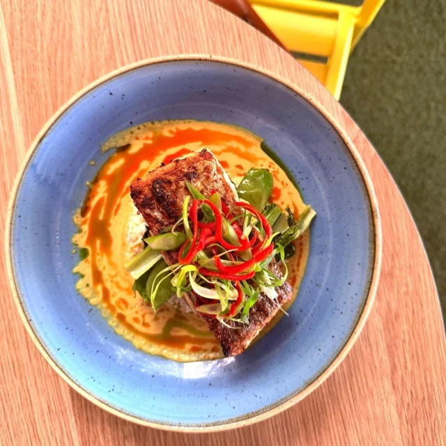 Crispy-skin barramundi with curry, fresh herbs and chilli at Snapper Rocks