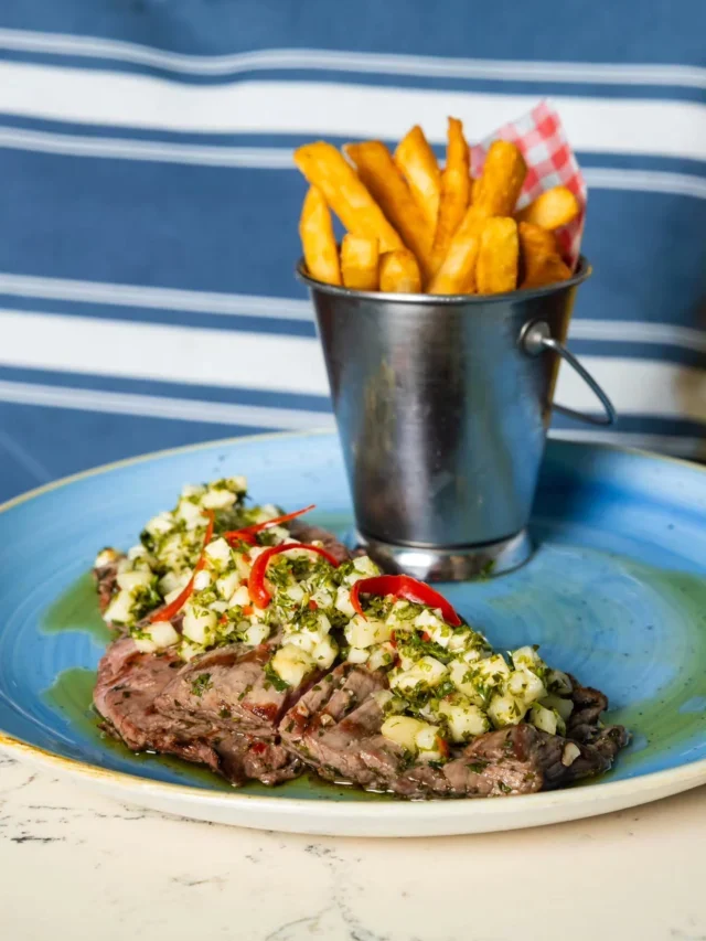 A grilled dish, salad and chips at Snapper Rocks