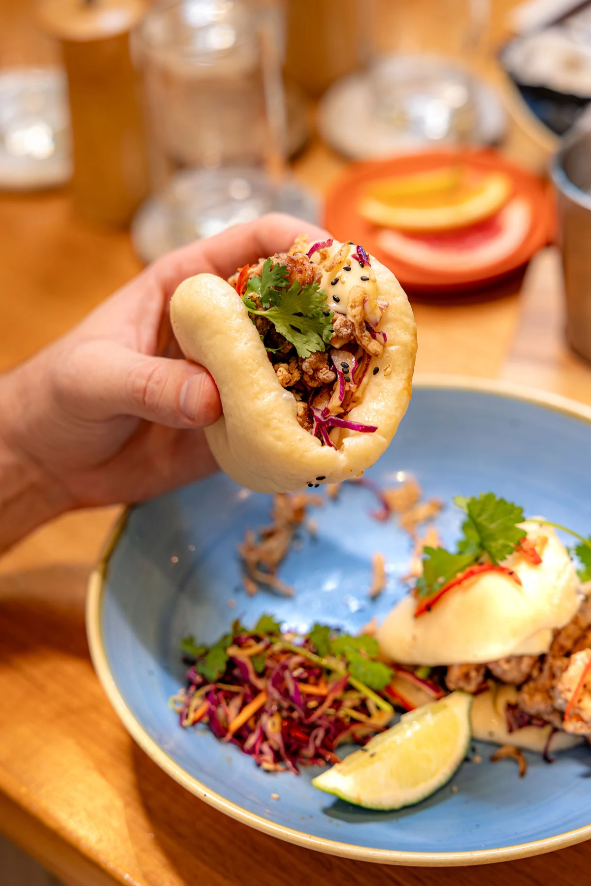 A bao bun with slaw, herbs and lime at Snapper Rocks