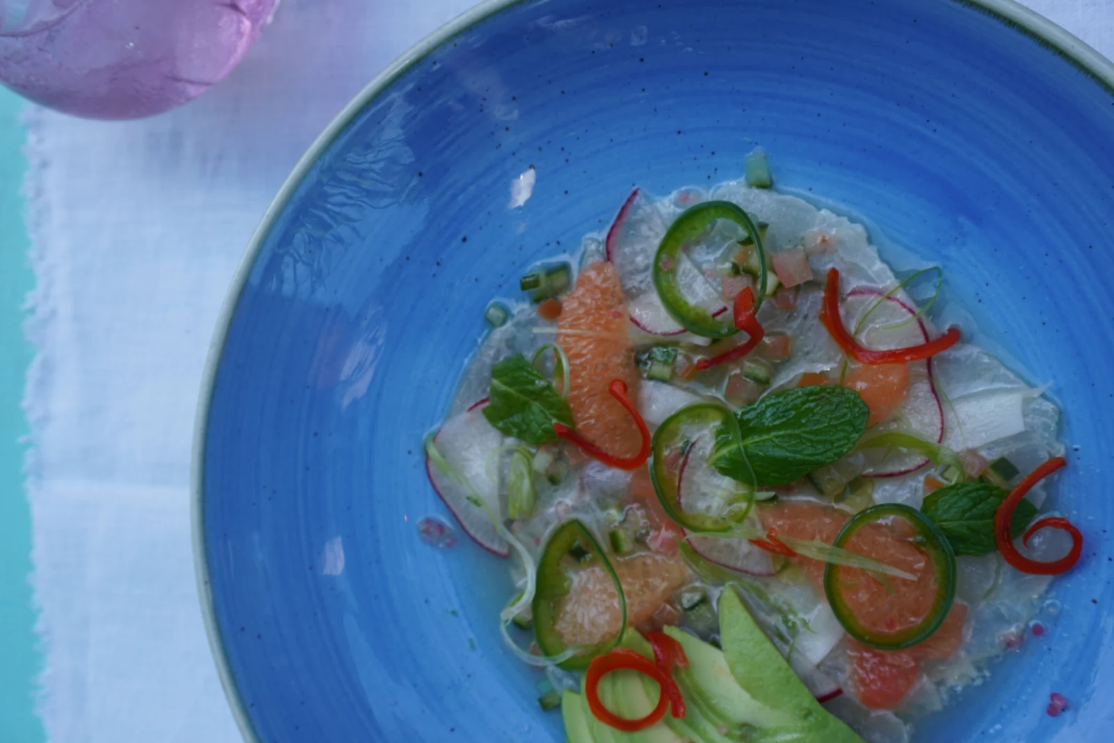 Reef fish ceviche in a blue bowl