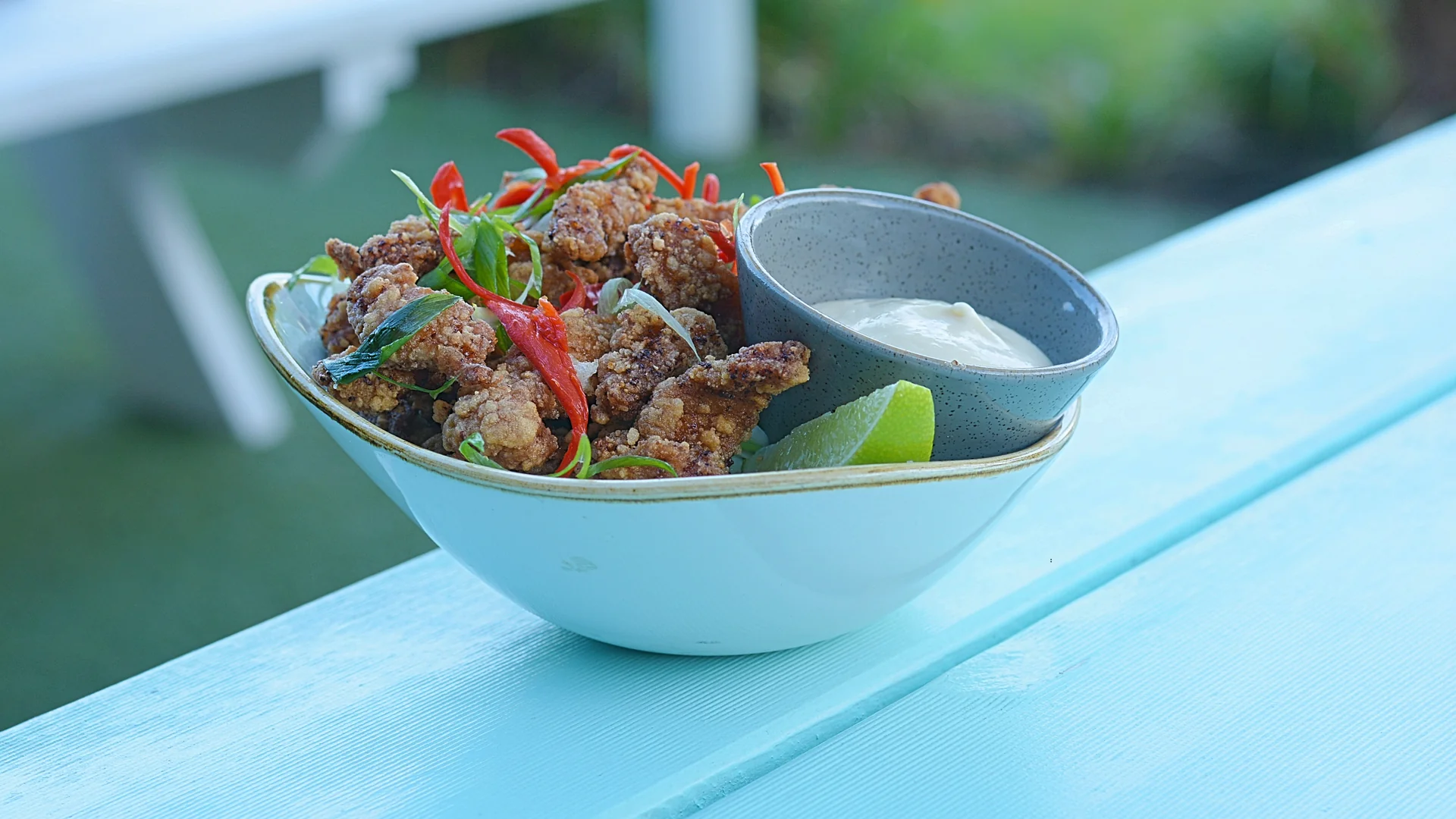 Salt and pepper crocodile with lime and dipping sauce at Snapper Rocks